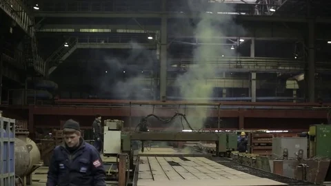 Working on the production and processing of metal in a large factory Stock Footage 73759406