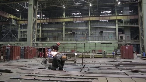 Working on the production and processing of metal in a large factory Stock Footage 73759601