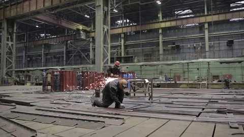 Working on the production and processing of metal in a large factory Stock Footage 73759683