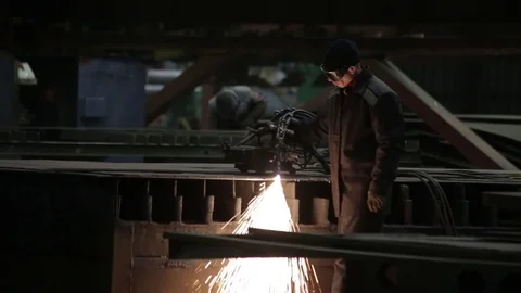 Working on the production and processing of metal in a large factory Stock Footage 73759726