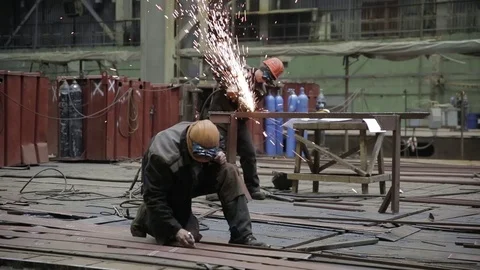 Working on the production and processing of metal in a large factory Stock Footage 73759799