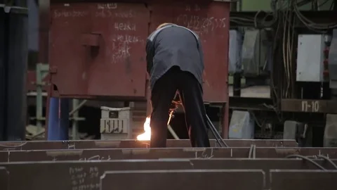 Working on the production and processing of metal in a large factory Stock Footage 73759881