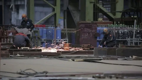 Working on the production and processing of metal in a large factory Stock Footage 73759966