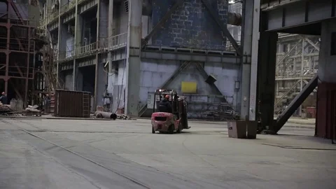 Working on the production and processing of metal in a large factory Stock Footage 73760385