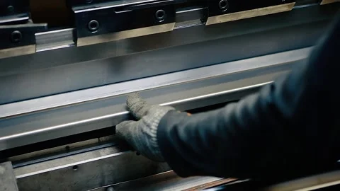 Working in production.Operator working on sheet metal cutting and bending, Video stock 153628579