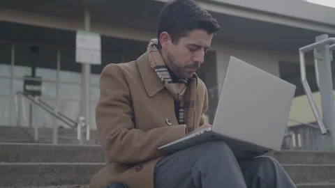 Working Professional Sits Typing On Laptop Outdoors Stock Footage 270336578