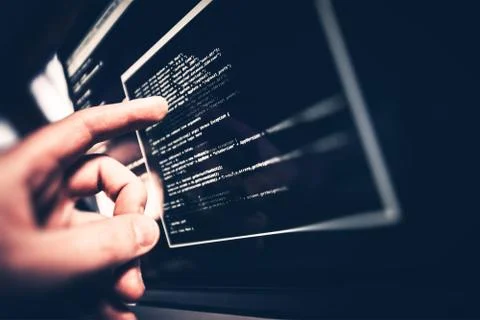 Working Programmer. Programmer Showing Code Issue on the Screen. Stock Photos