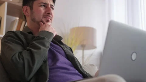 Working programmer. software bugs man laptop home Stock Footage 169865284