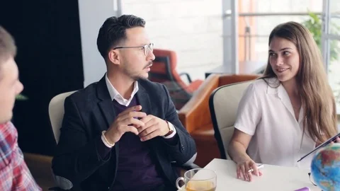 Working on project in company Stock Footage 80215707