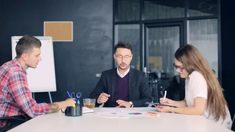 Working on project in company Stock Footage 80951133