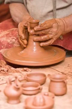 Working with raw clay. Stock Photos