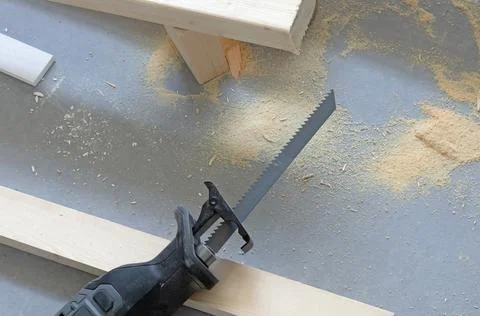 Working with a reciprocating saw Stock Photos