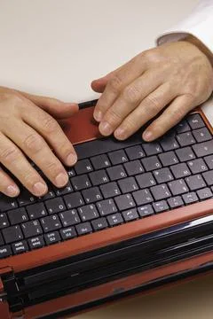 Working With Red Laptop Stock Photos