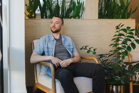 Working from a remote job while enjoying a break at a modern office space w.. Fotos Stock