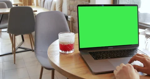 Working remote. Woman using Green screen laptop computer in coffeeshop.  Stock Footage 135814280
