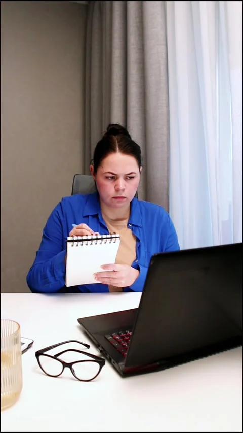 Working remotely from cozy home interior. Woman enjoys location independent Stock Footage 321897887