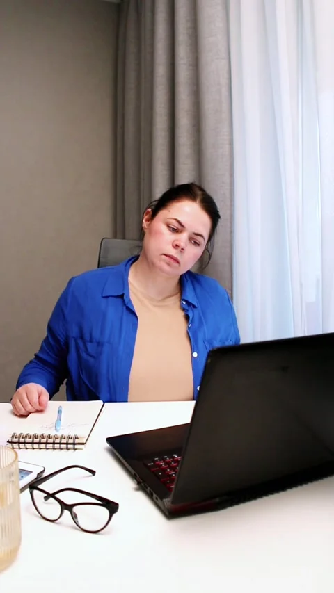 Working remotely from cozy home interior. Woman enjoys location independent Stock Footage 323082421