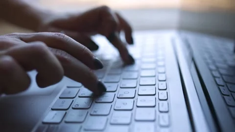 Working Remotely. Stay At Home. Close up of fingers typingon laptop. Young Woman Stock Footage 133282152