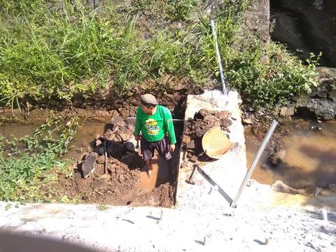 Working on River Utilization Project Into a Fish Pond Stock Photos