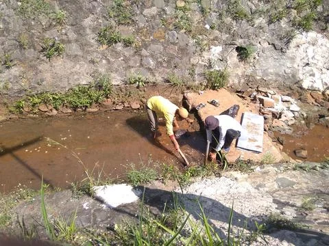 Working on River Utilization Project Into a Fish Pond 写真素材