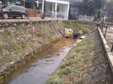 Working on River Utilization Project Into a Fish Pond Stock Photos