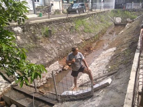 Working on River Utilization Project Into a Fish Pond Stock Photos