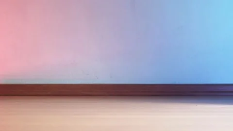 Working robot vacuum cleaner. red and blue lights on the wall. no furniture. Stock Footage 135952978