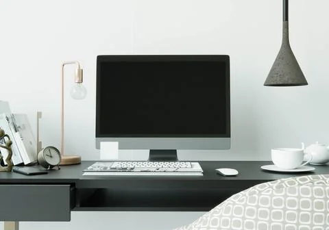 A working room with a computer placed on the table Illustration