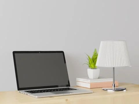 A working room with a laptop with a lamp placed on the table. Stock Illustration