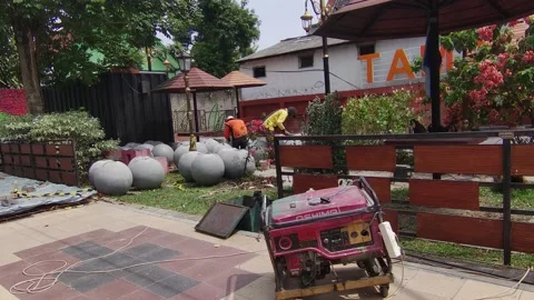 Working On Round Bollards in A Park Видео 211796929