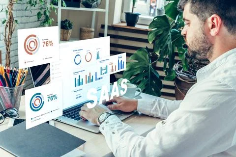 Working on SaaS project with data visualization and charts in a modern office Stock Photos