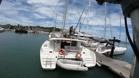 Working on a sailing catamaran Stock Footage 162676460