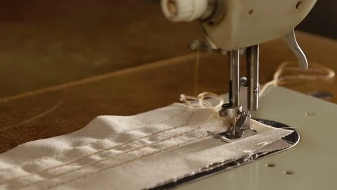 Working on the sewing machine Stock Footage 78772094