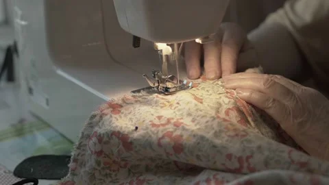 Working on sewing machine Видео 113957023