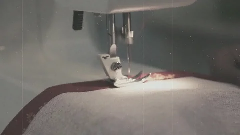 Working on the sewing machine, old film effect Stock Footage 100673034