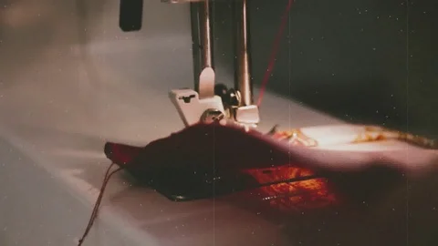 Working on the sewing machine, old film effect Stock Footage 100673045
