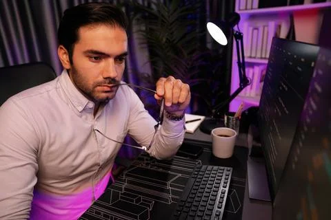 Working smart IT developer analyzing data software development on pc. Surmise. Stock Photos