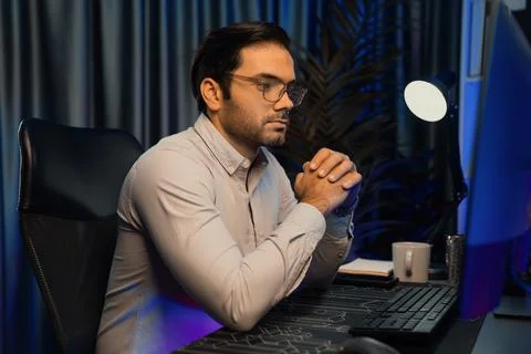 Working smart IT developer analyzing data software development on pc. Surmise. Stock Photos