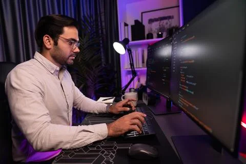 Working smart IT developer analyzing data software development on pc. Surmise. Stockfoto's