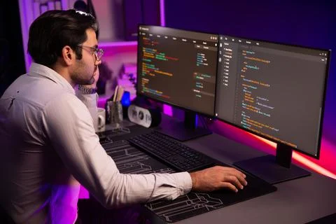 Working smart IT developer analyzing data software development on pc. Surmise. Stock Photos