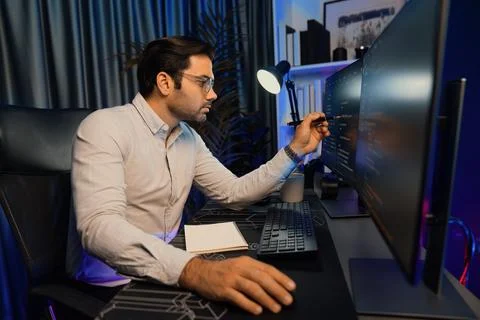 Working smart IT developer pointing data software development on pc. Surmise. 스톡 사진