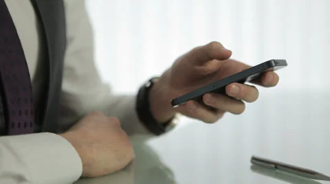 Working on a Smartphone Stockbeeldmateriaal 31762895