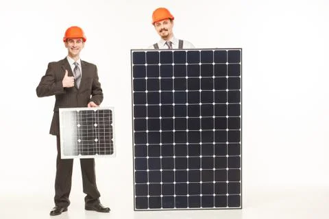 Working with solar panels smiling Stock-Fotos