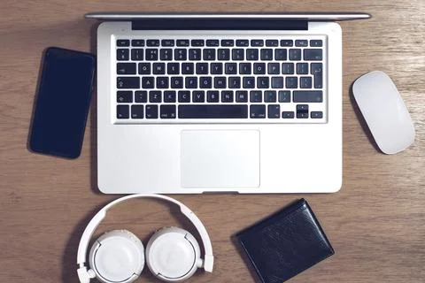 Working space with a computer samrtphone mouse wallet and headphones 스톡 사진