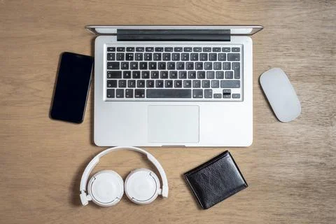 Working space with a computer samrtphone mouse wallet and headphones 스톡 사진