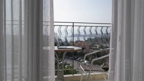 Working space on the terrace. There is a table with a laptop on the terrace. 4K Stock Footage 97978356