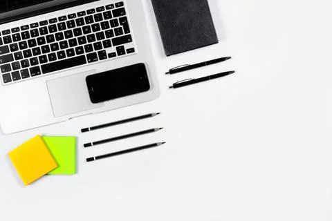 Working table top view, flat lay. Business items on a white table, laptop, pe Foto stock