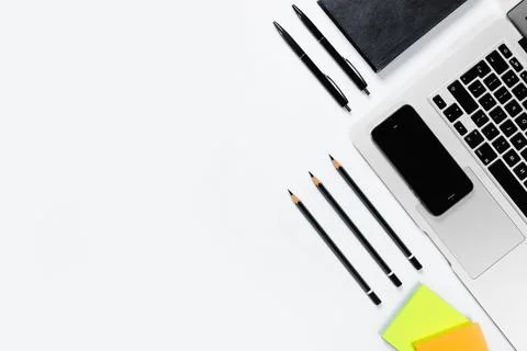 Working table top view, flat lay. Business items on a white table, laptop, pe Stock Photos