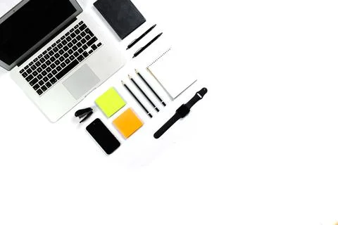 Working table top view, flat lay. Business items on a white table, laptop, cl Stock Photos