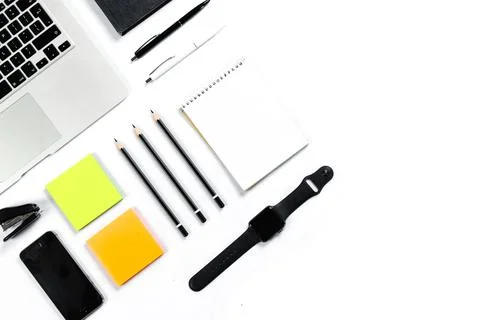 Working table top view, flat lay. Business items on a white table, laptop, cl Stock Photos